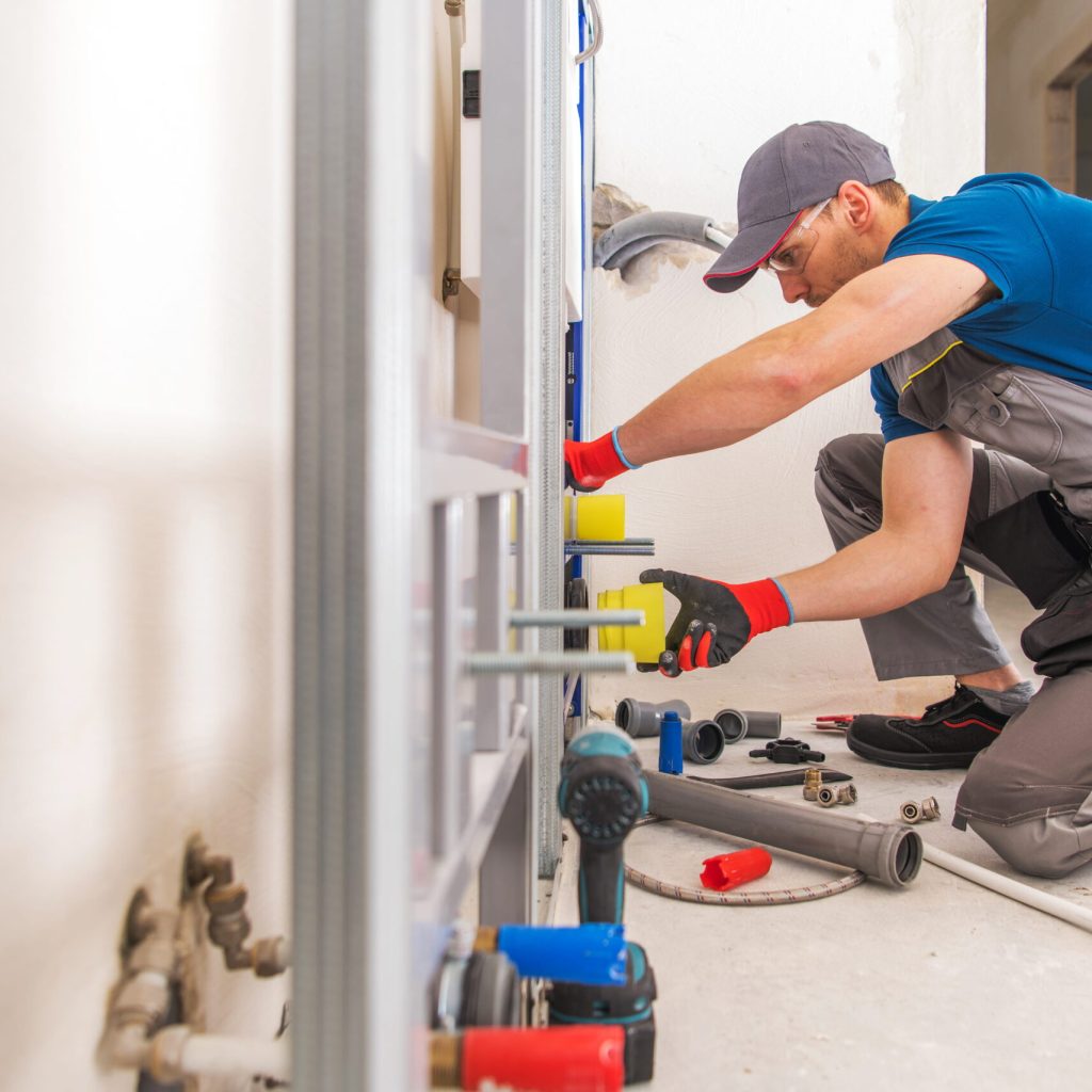 worker checking hvac system 2 scaled.jpg